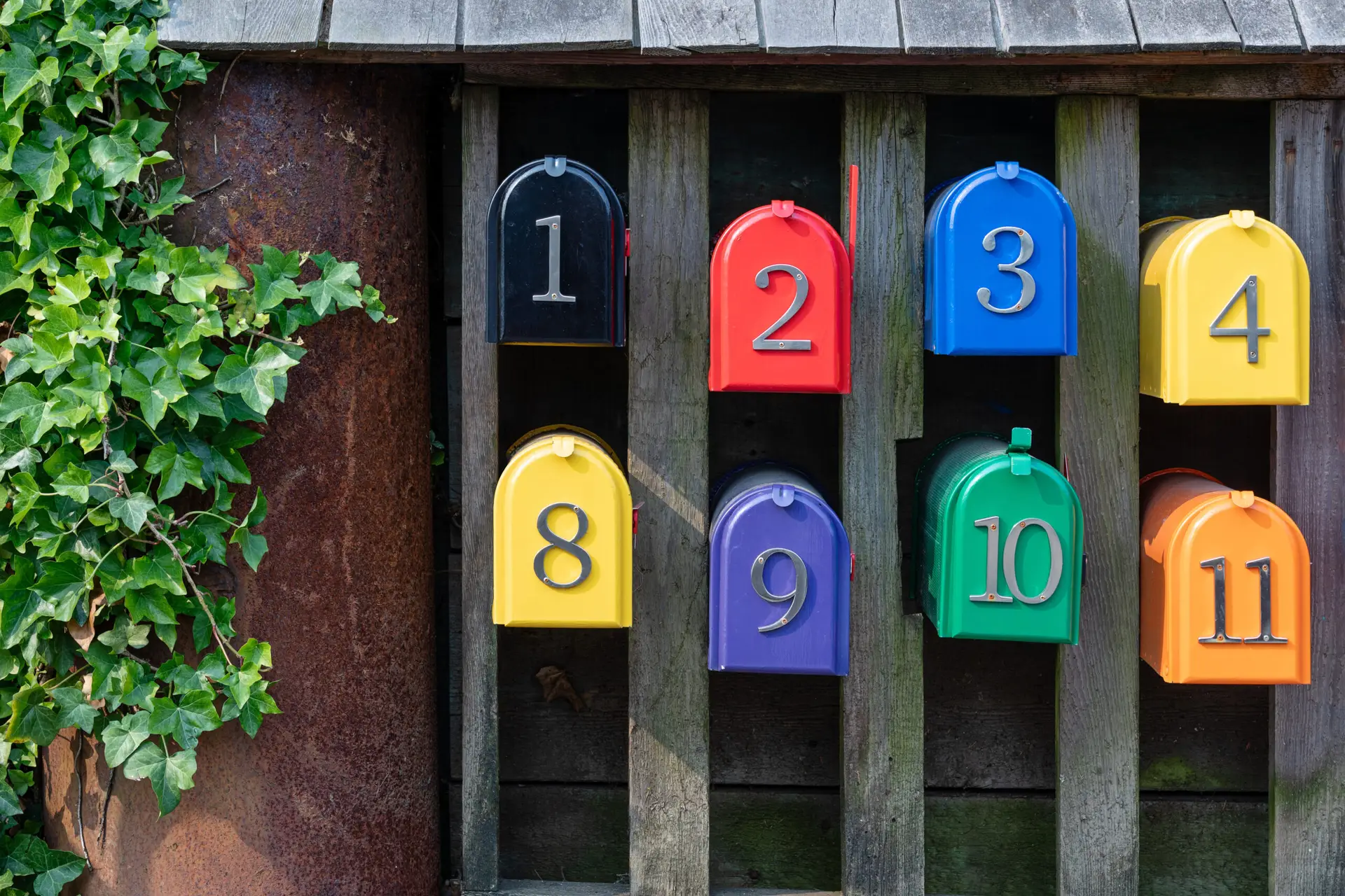 A row of colourful numbered postal boxes